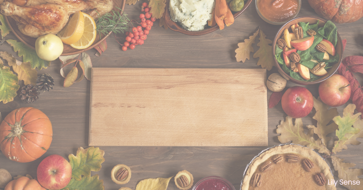 photo of some thanksgving food items ready to be prepped with a wooden chopping board in the middle