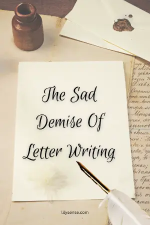 a desk with an envelope, ink pot and a page with the caption. The sad demise of letter writing.