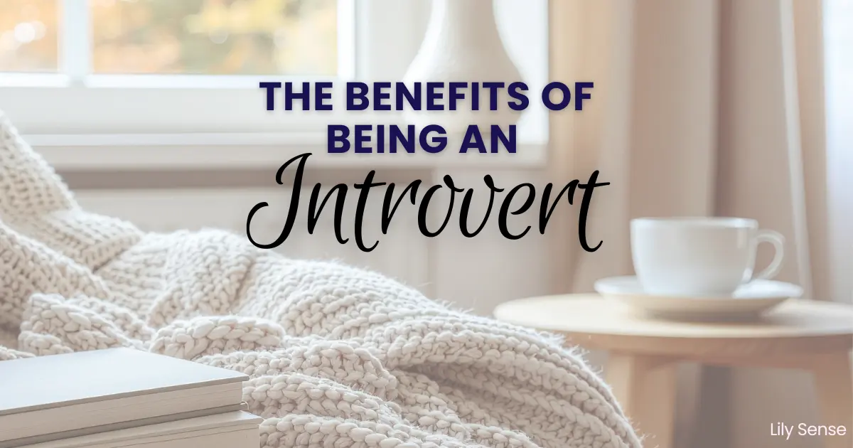 A photo of a cosy sofa with cushions and blanket. A cup of tea on the table beside. The Caption reads "The benefits of being an introvert"