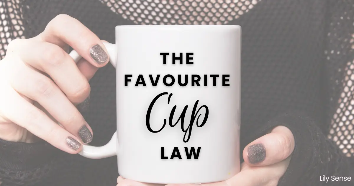 A photo of a woman holding a cup in her hands with the caption "The favourite cup law