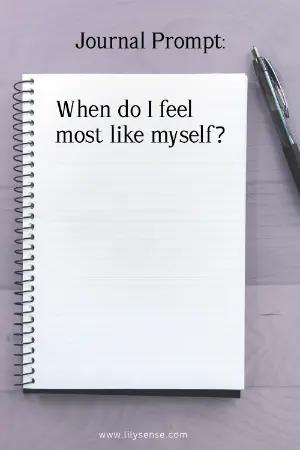 A notebook on a table with the prompt When do I feel most like myself?