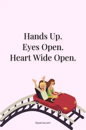 A picture of two people enjoying a rollercoaster ride before the drop. The caption reads hands up eyes open and hearts wide open